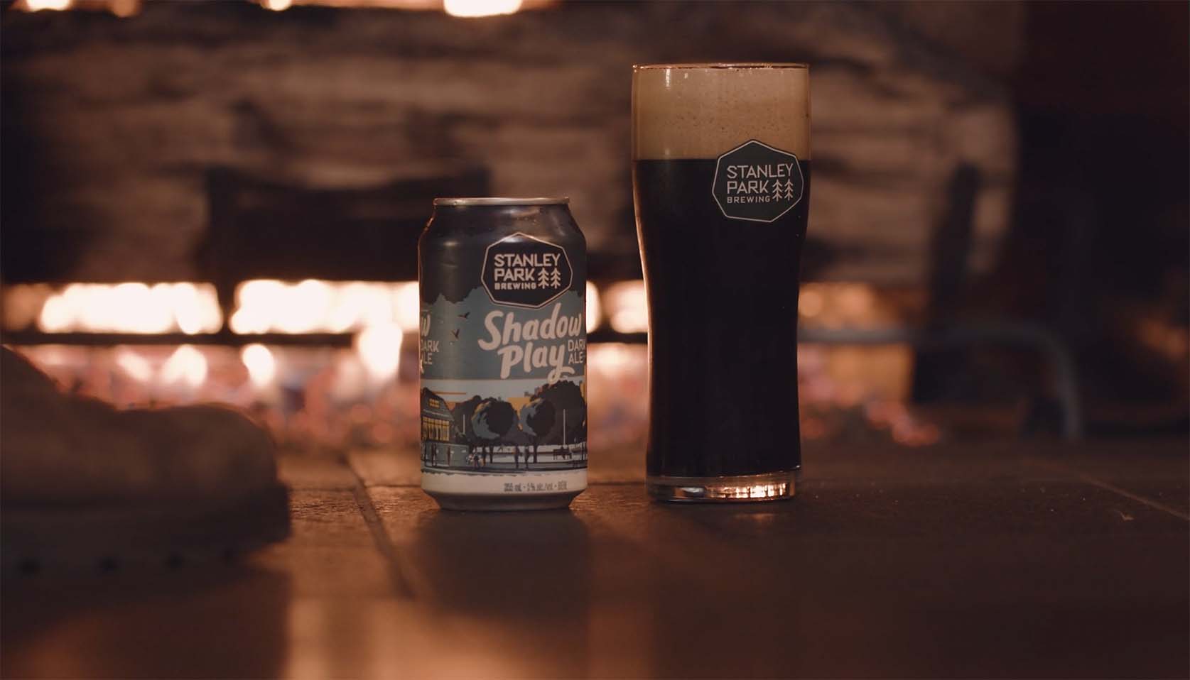 Beer Can and Glass of Beer in front of fireplace.